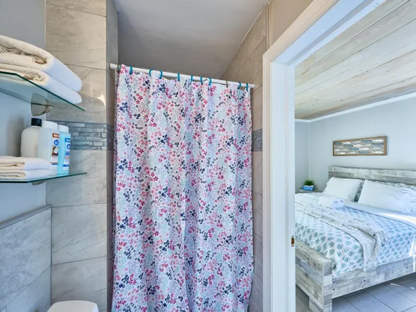 a bedroom with a bed and a couch