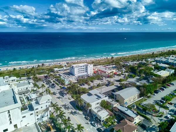 an aerial view of residential building and ocean