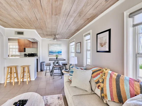 a living room with furniture and flat screen tv