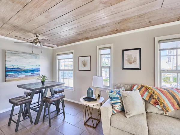 a bedroom with furniture and a large window