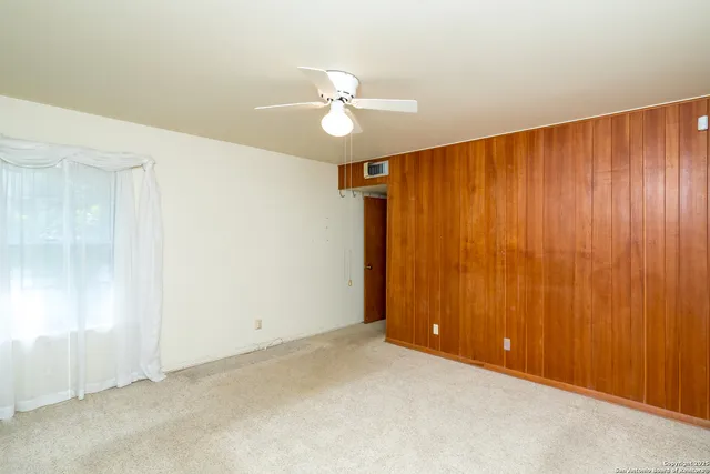 an empty room with a empty space and window