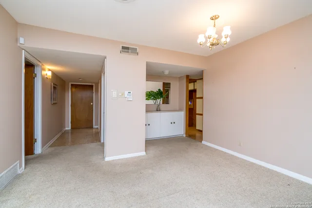 a view of an empty room with a bathroom