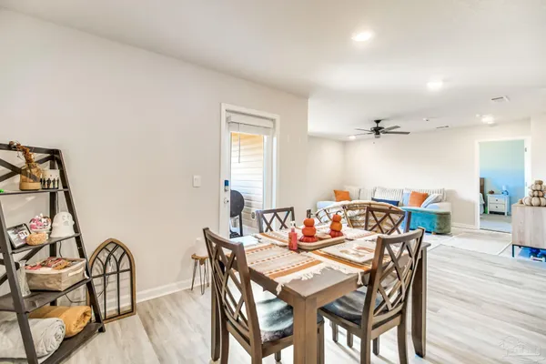 a bedroom with a bed and a large mirror