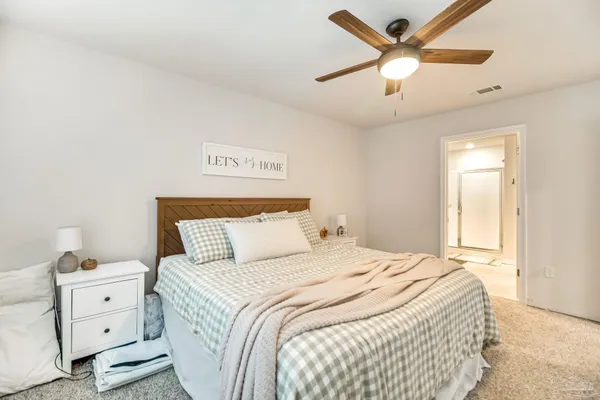 a view of a patio with a table chairs and a yard