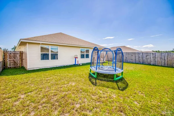 a view of a yard with a lake view