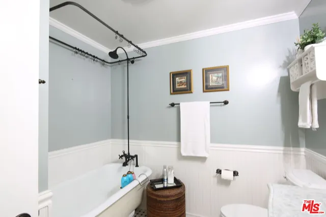 a bathroom with a bathtub and shower