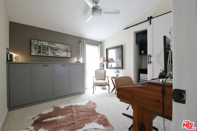 a bedroom with furniture and a window