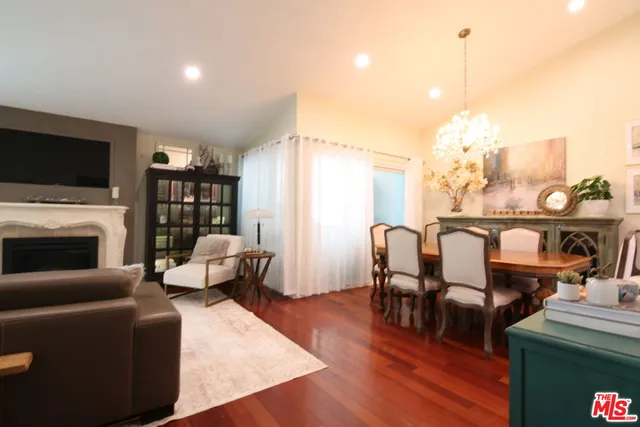 a living room with fireplace furniture and a flat screen tv