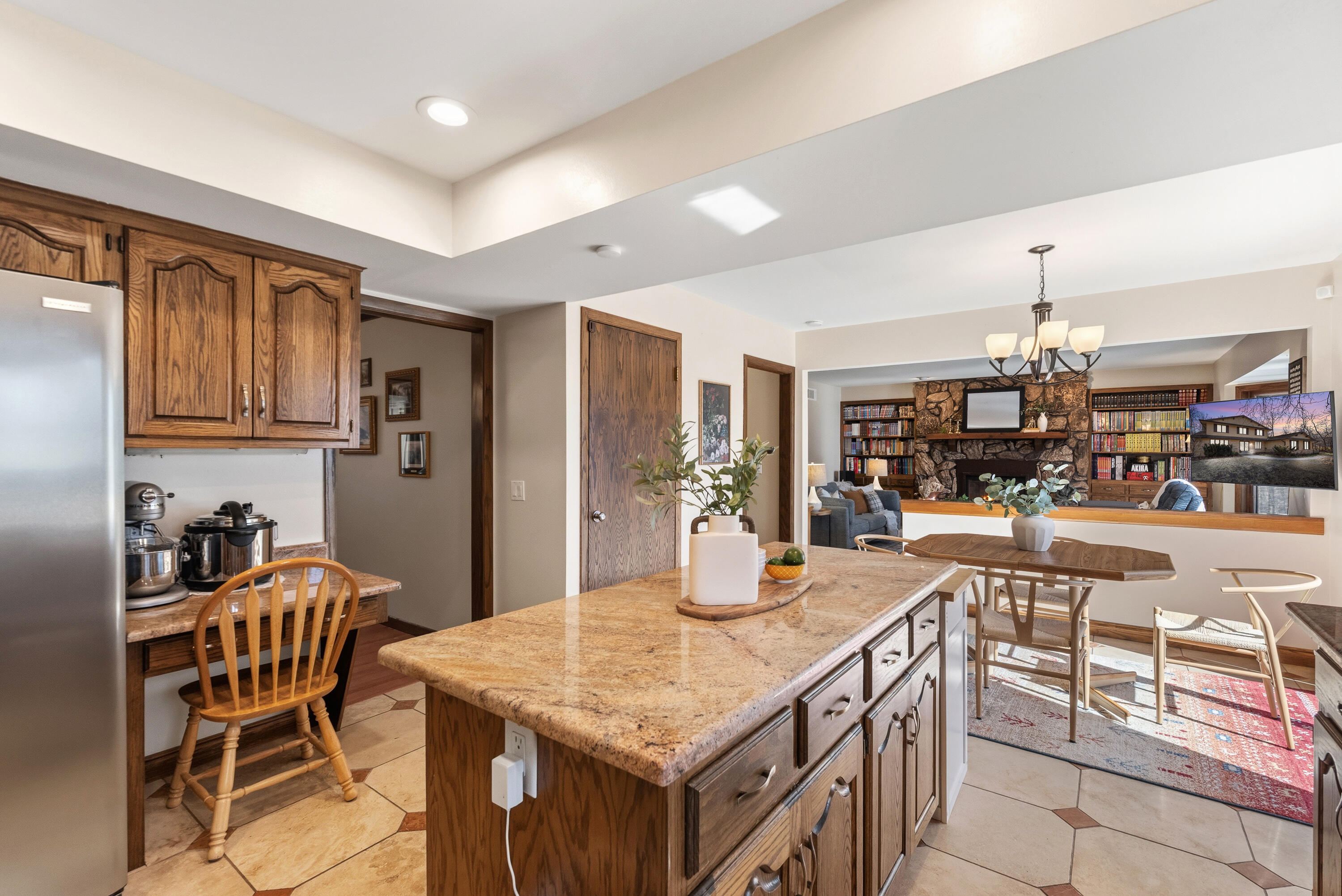 12785 West Bobwood Road New Berlin, WI 53151 - Photo 7 of 39 Gorgeous Granite Counters and Stainless Steel Appliances, Kitchen Open to Family Room