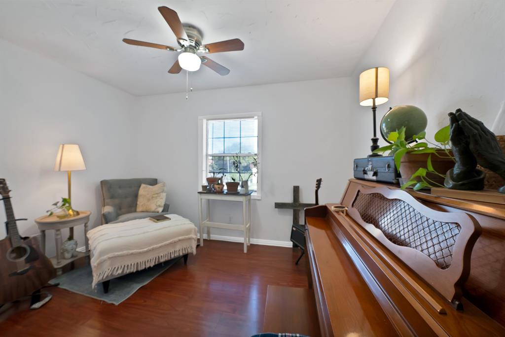 9519 County View Road Dallas, TX 75249 - Photo 13 of 31 Bright interior space featuring wood-finish flooring and white walls