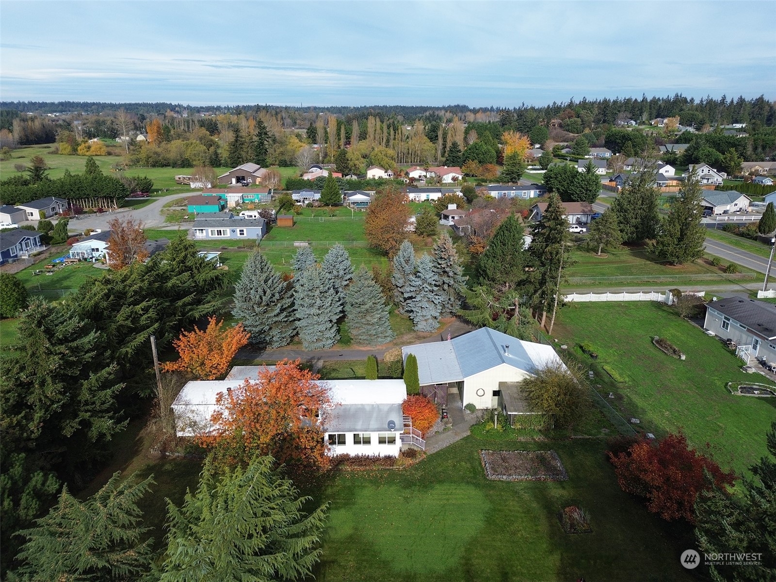 241 Evans Road Sequim, WA 98382 - Photo 37 of 40 an aerial view of residential houses with outdoor space and river