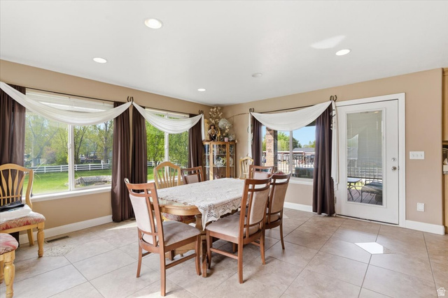 6237 West 4600th Street South Hooper, UT 84315 - Photo 11 of 48 Dining area with light tile patterned floors and recessed lighting