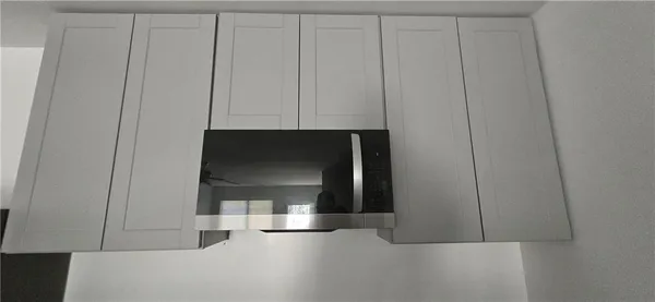 a view of a utility room with closet