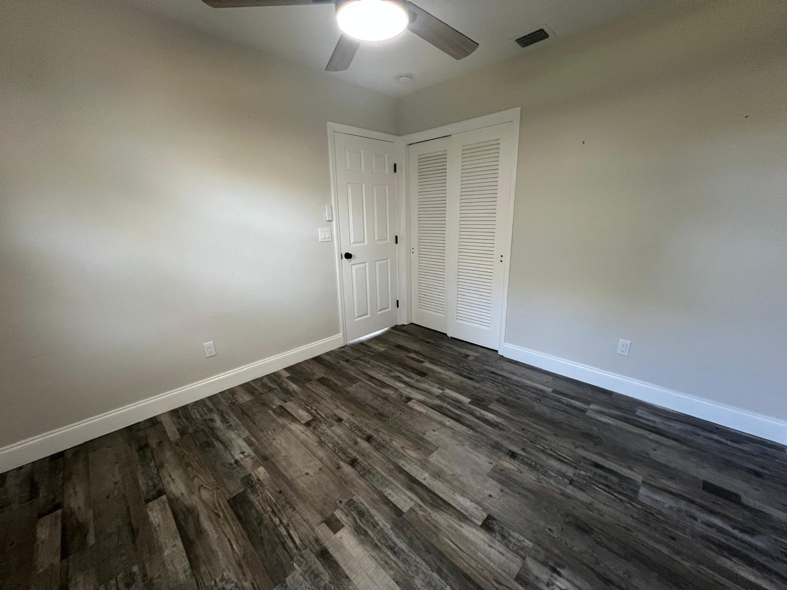 1625 North M Street Lake Worth Beach, FL 33460 - Photo 13 of 23 a view of room with wooden floor and ceiling fan
