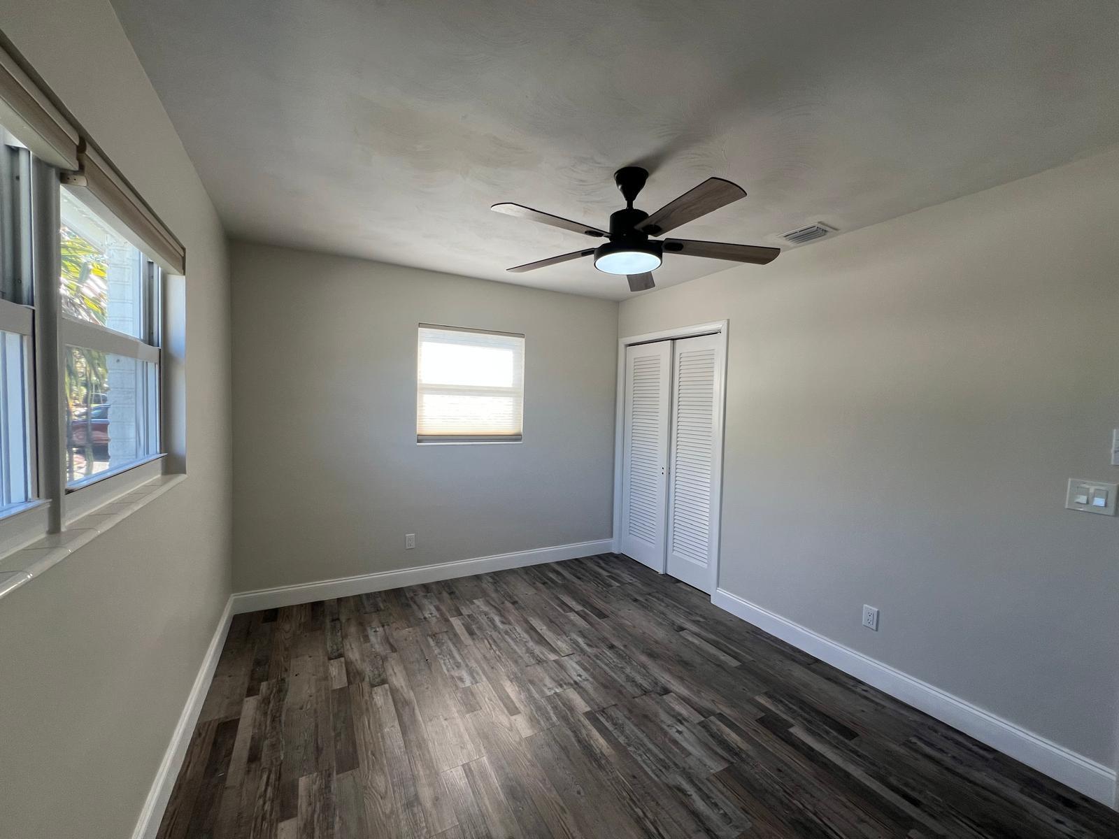 1625 North M Street Lake Worth Beach, FL 33460 - Photo 17 of 23 wooden floor in an empty room with a window