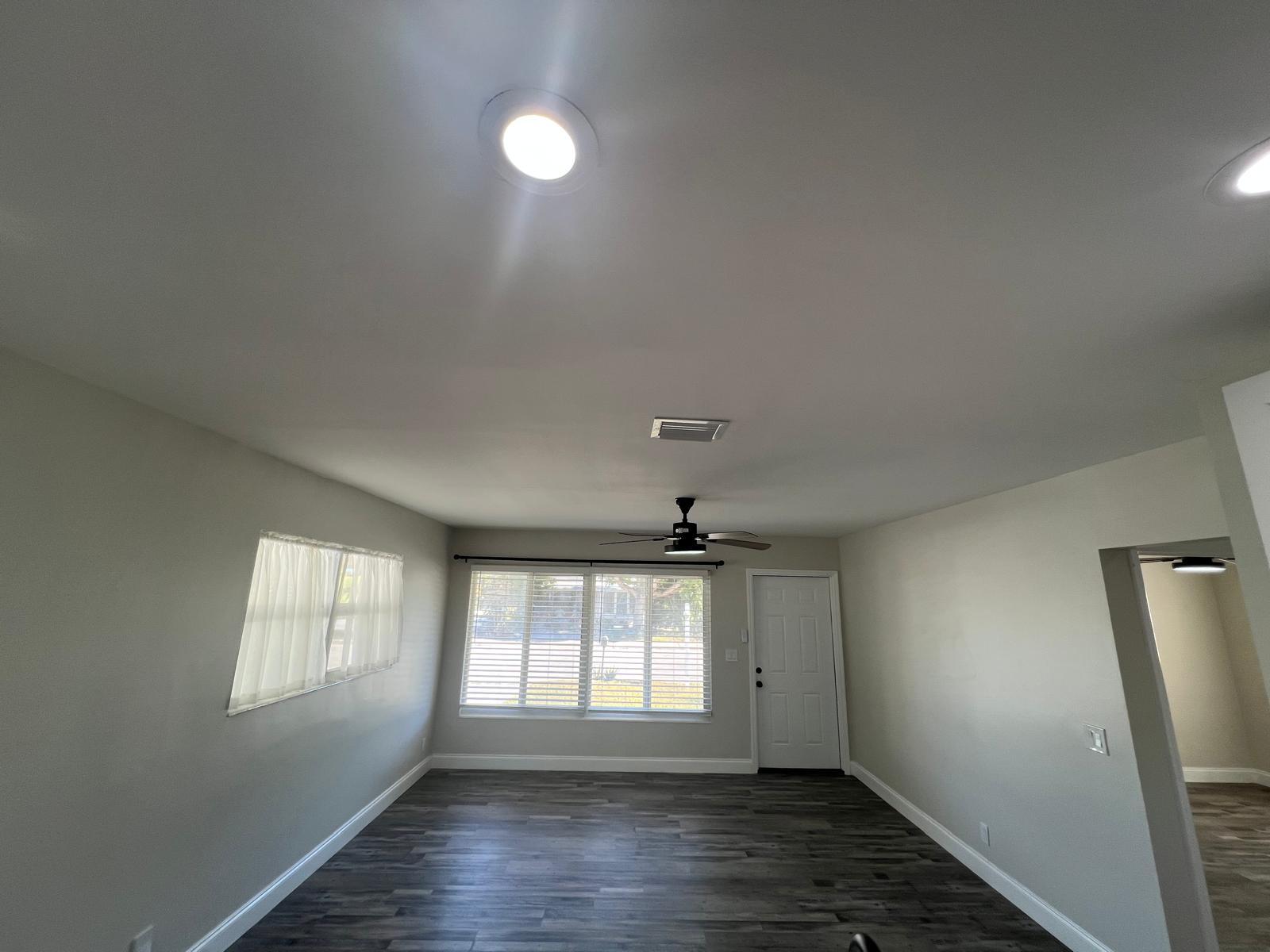 1625 North M Street Lake Worth Beach, FL 33460 - Photo 19 of 23 an empty room with wooden floor and windows