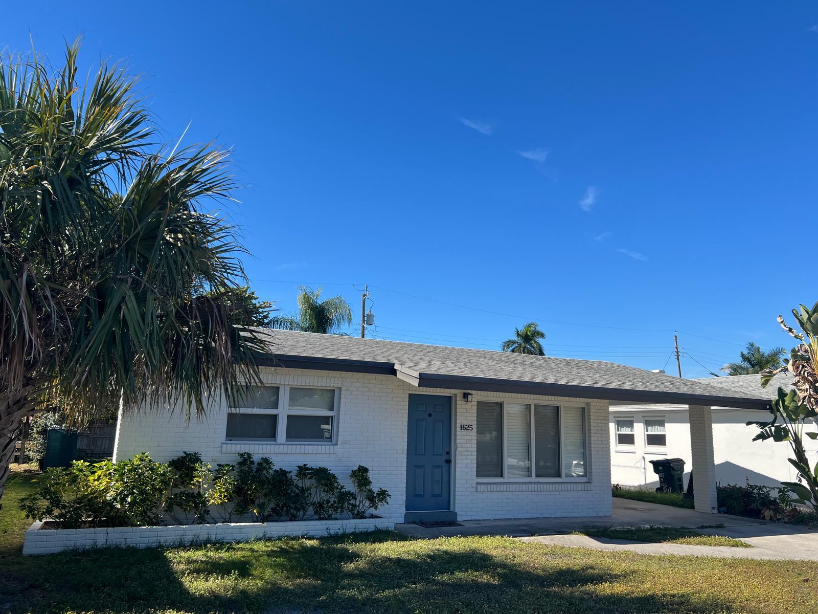 1625 North M Street Lake Worth Beach, FL 33460 - Photo 2 of 23 a view of a house with swimming pool and a yard