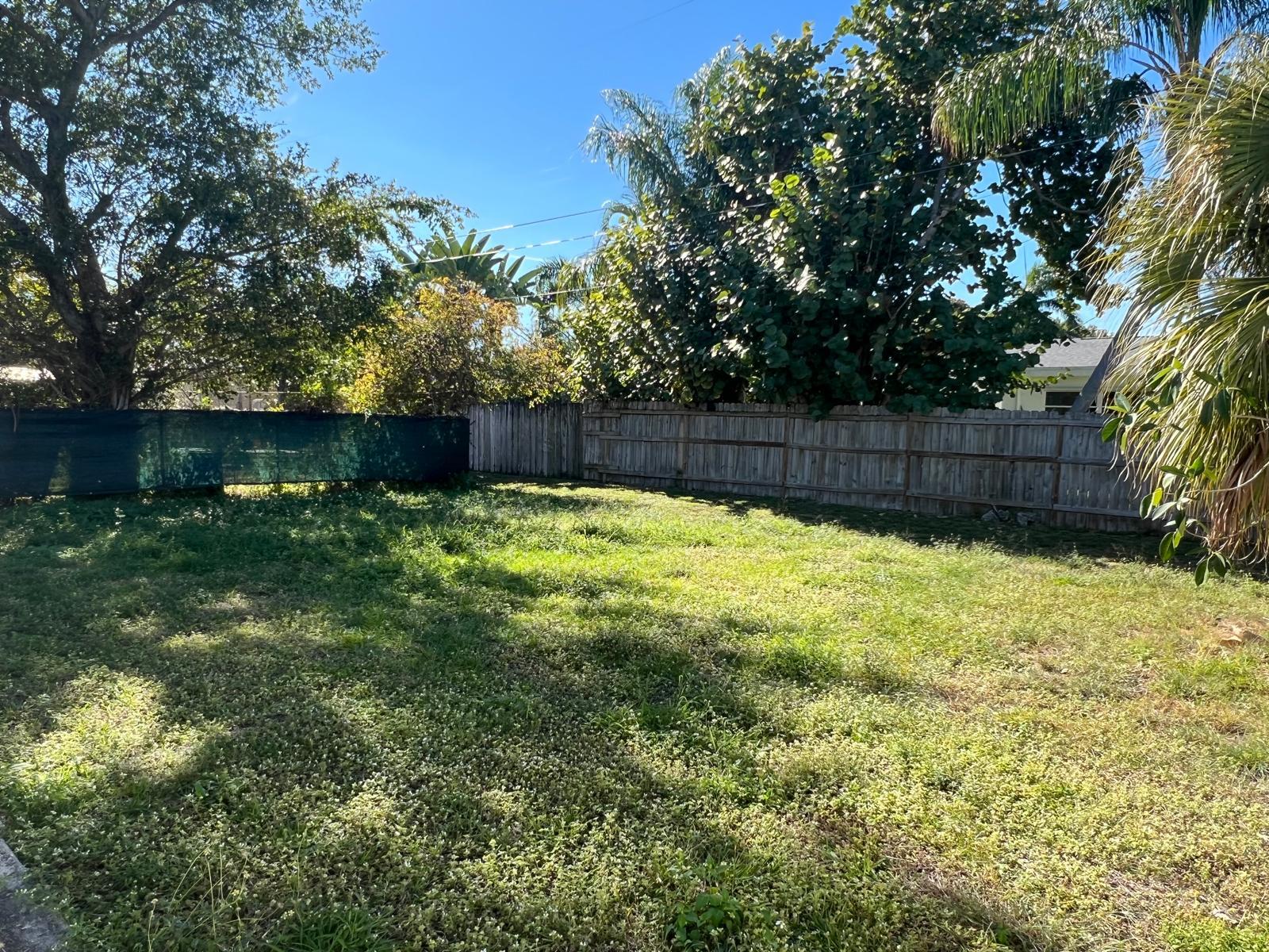 1625 North M Street Lake Worth Beach, FL 33460 - Photo 21 of 23 a swimming pool with wooden fence