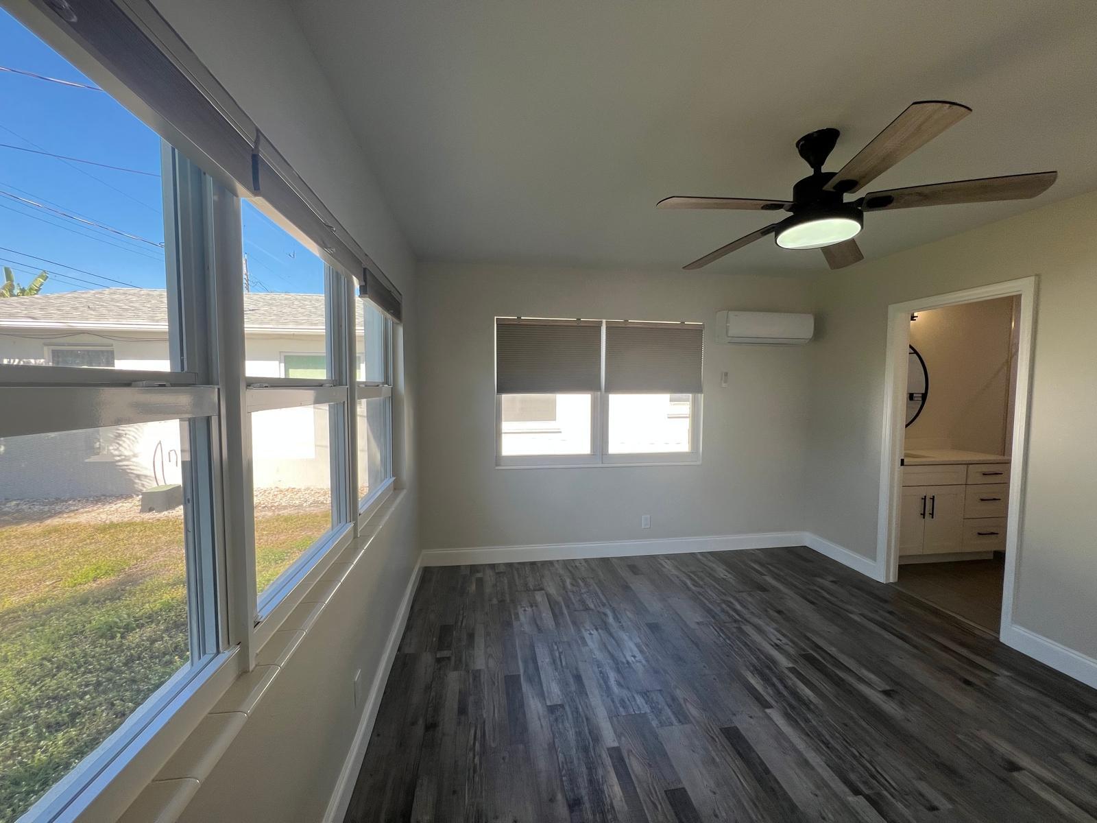 1625 North M Street Lake Worth Beach, FL 33460 - Photo 9 of 23 a view of empty room with wooden floor and fan