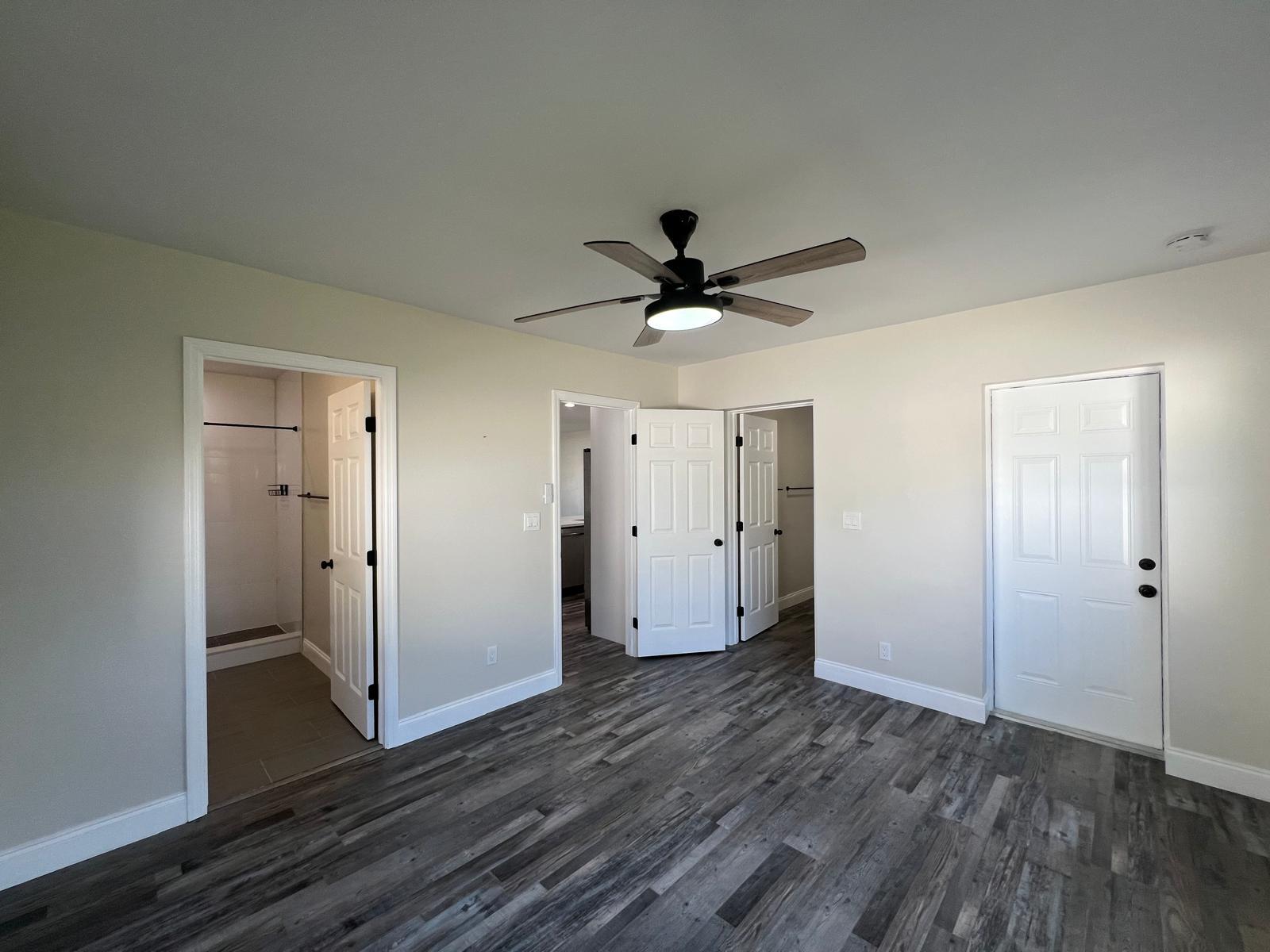 1625 North M Street Lake Worth Beach, FL 33460 - Photo 10 of 23 a view of a livingroom with wooden floor and a ceiling fan