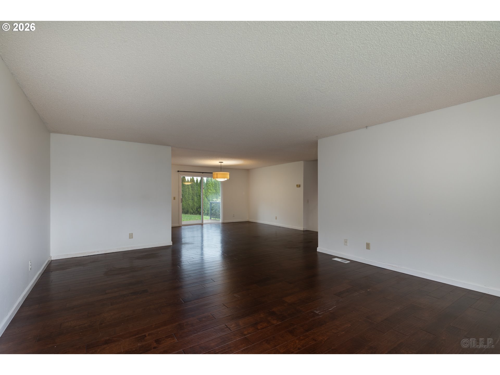 32859 Northwest Overlook Street Scappoose, OR 97056 - Photo 3 of 16 a view of an empty room and wooden floor