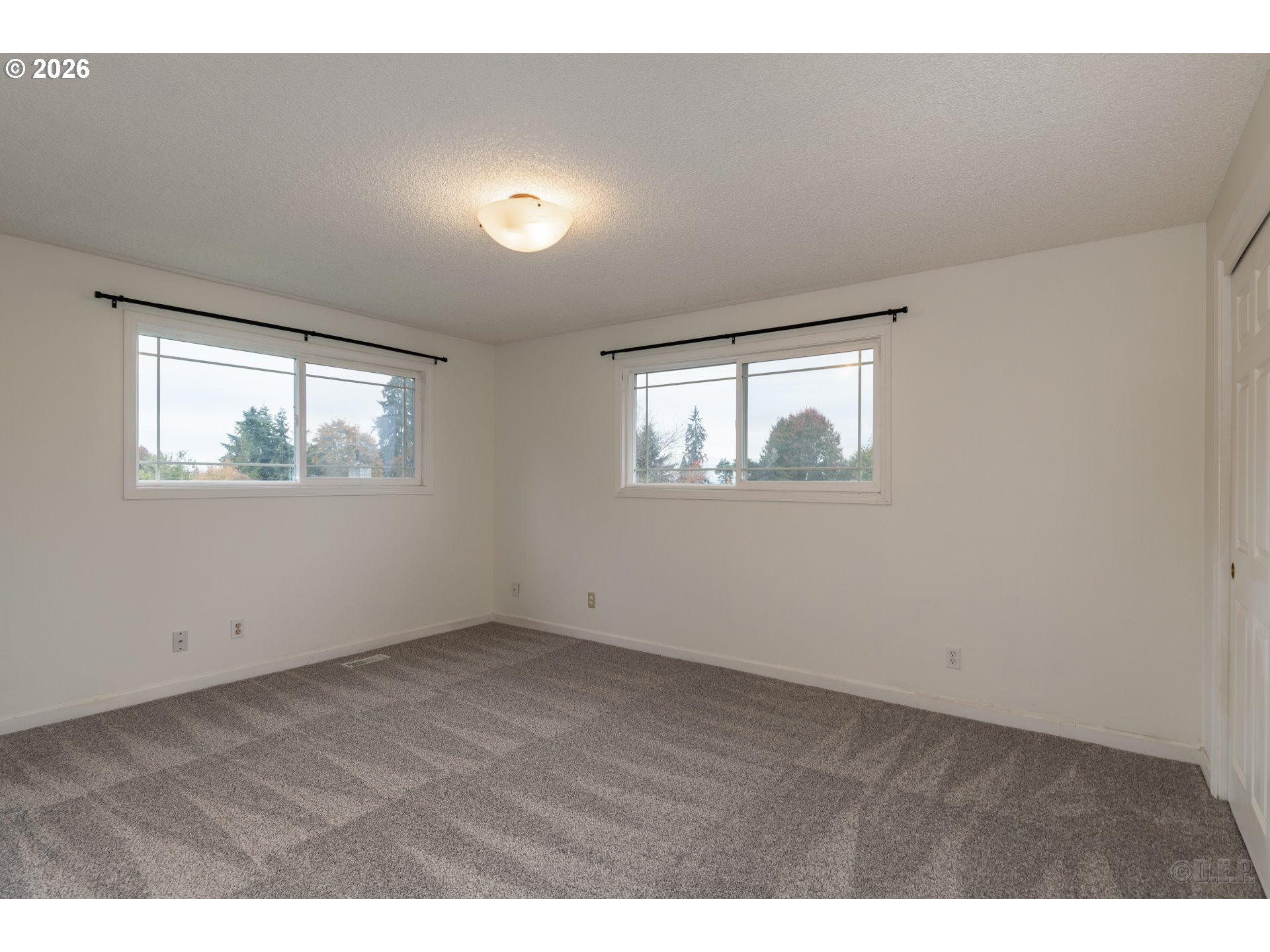 32859 Northwest Overlook Street Scappoose, OR 97056 - Photo 9 of 16 an empty room with windows