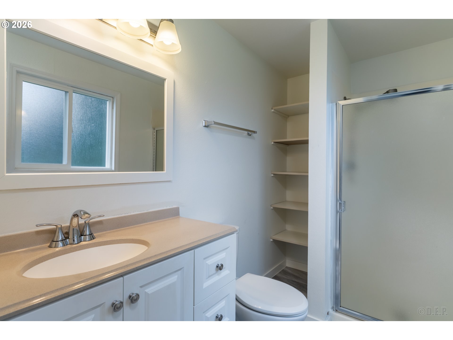 32859 Northwest Overlook Street Scappoose, OR 97056 - Photo 10 of 16 a bathroom with a granite countertop sink toilet a mirror and shower