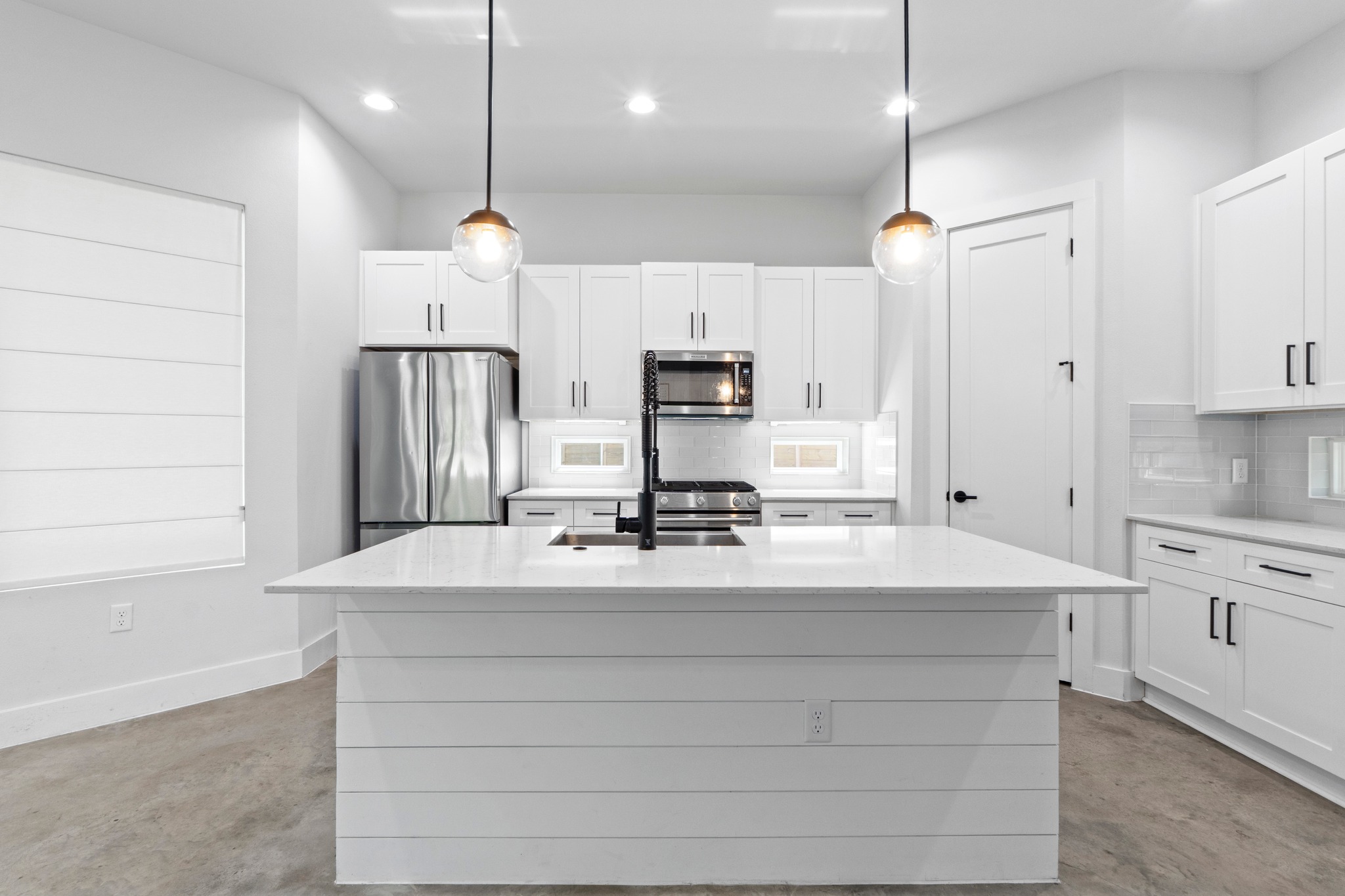 2007 Chestnut Avenue, Unit 1 Austin, TX 78722 - Photo 10 of 32 A pristine culinary space with an impressive center island and abundant cabinetry.