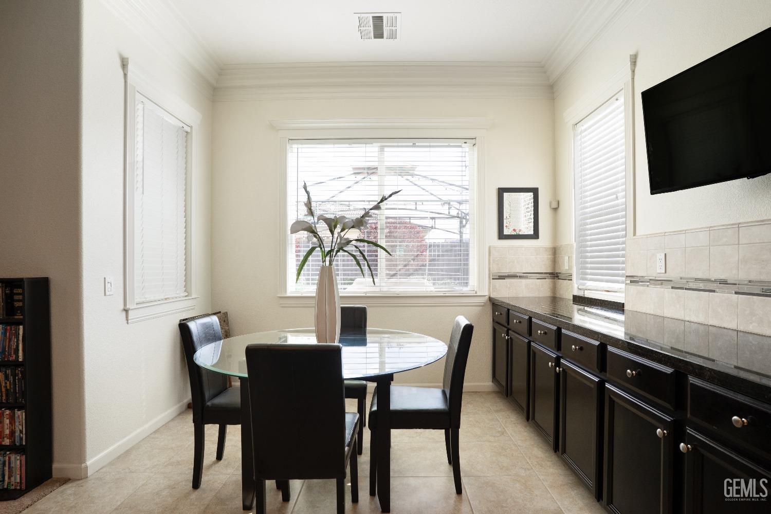 Undisclosed Address Bakersfield, CA 93314 - Photo 11 of 42 a view of a dining room with furniture and window