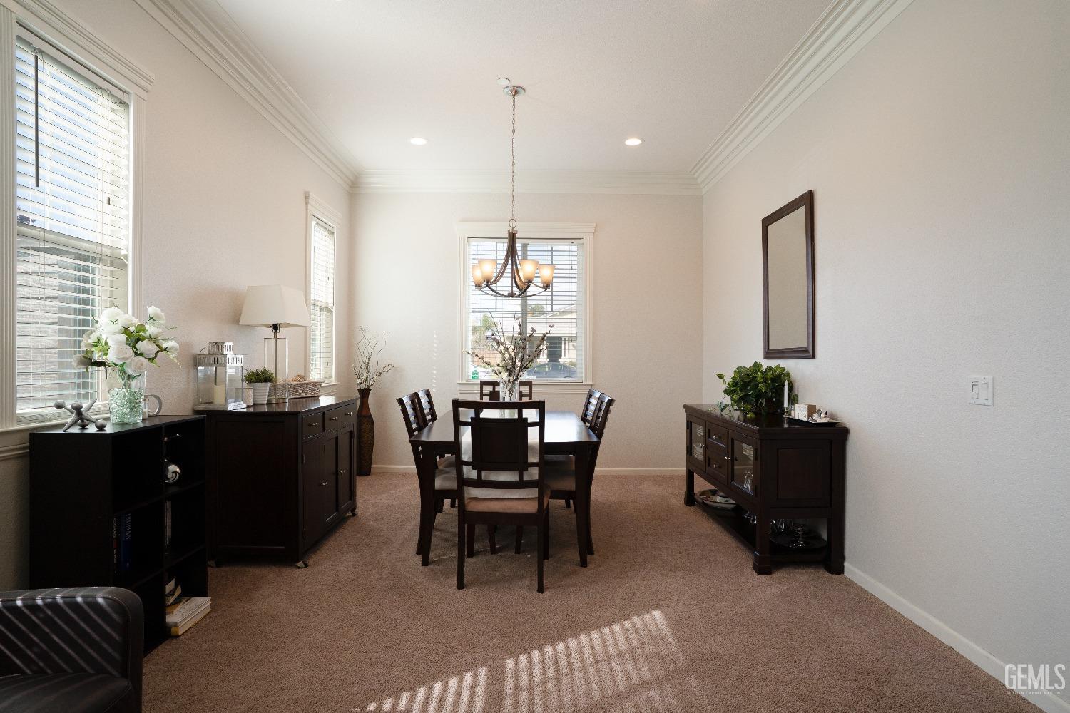 Undisclosed Address Bakersfield, CA 93314 - Photo 18 of 42 a dining room with a table and chairs
