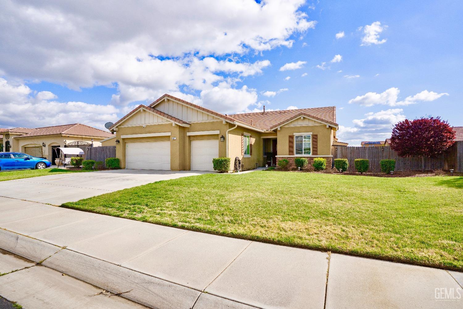 Undisclosed Address Bakersfield, CA 93314 - Photo 2 of 42 a front view of a house with garden