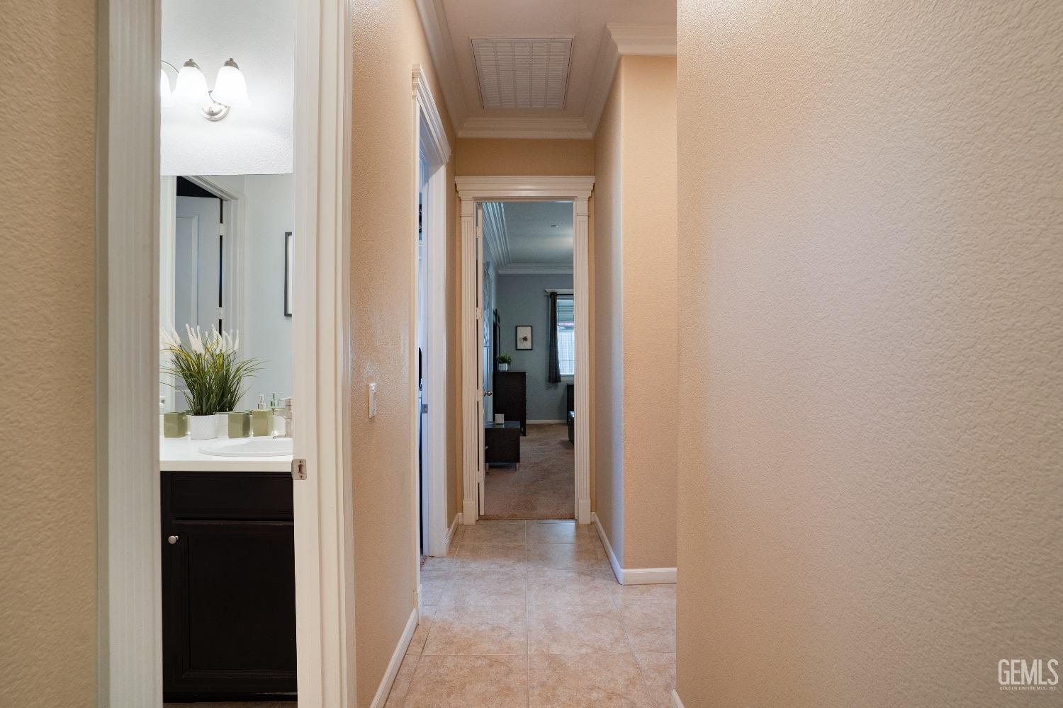 Undisclosed Address Bakersfield, CA 93314 - Photo 22 of 42 a view of a hallway and an entryway with wooden floor
