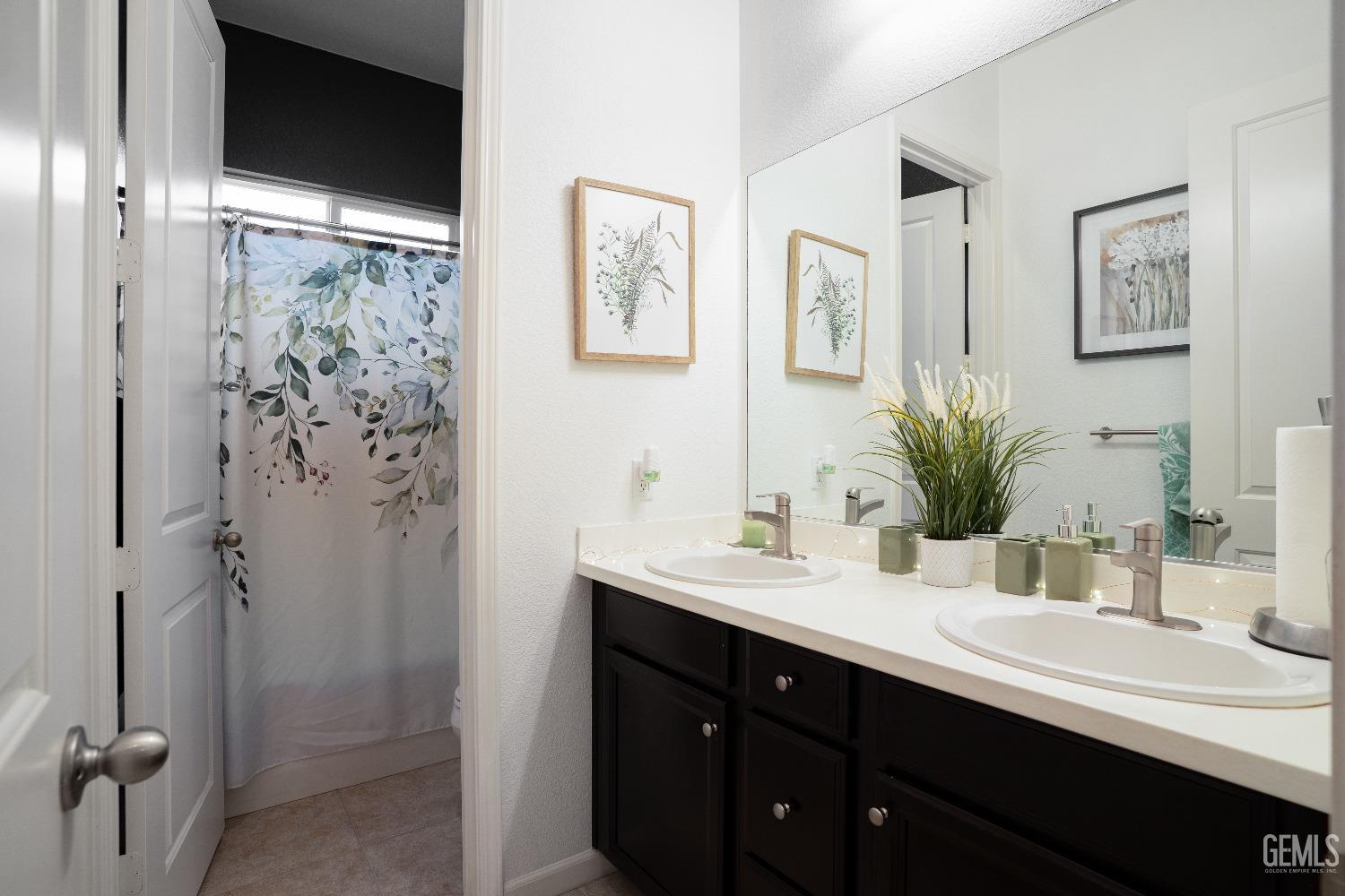 Undisclosed Address Bakersfield, CA 93314 - Photo 23 of 42 a bathroom with a double vanity sink mirror and shower