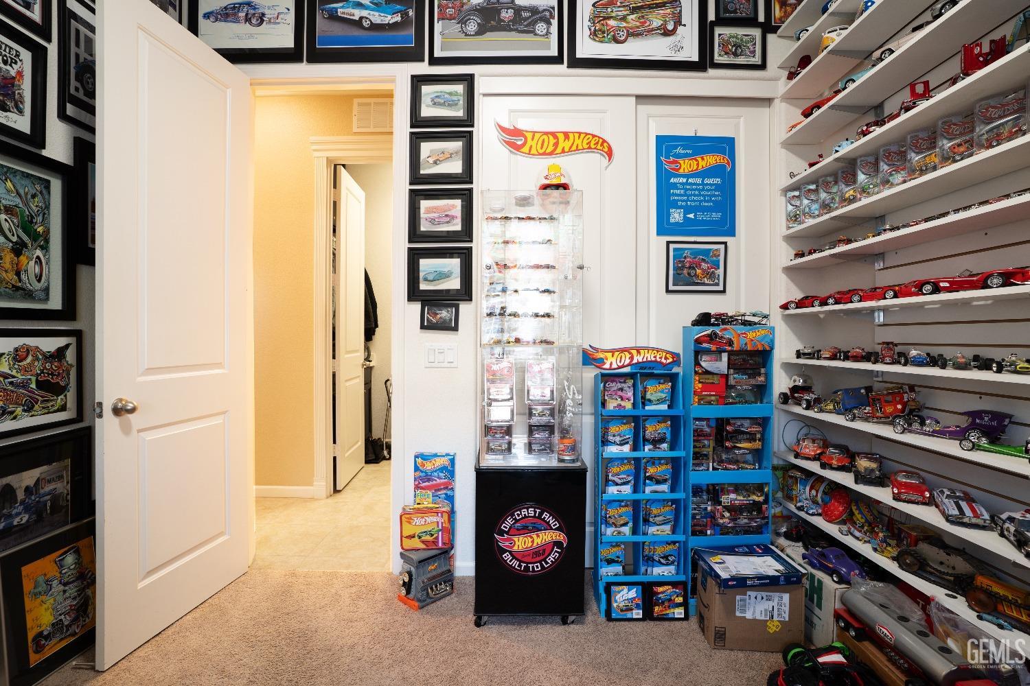 Undisclosed Address Bakersfield, CA 93314 - Photo 26 of 42 a room with furniture and a book shelf