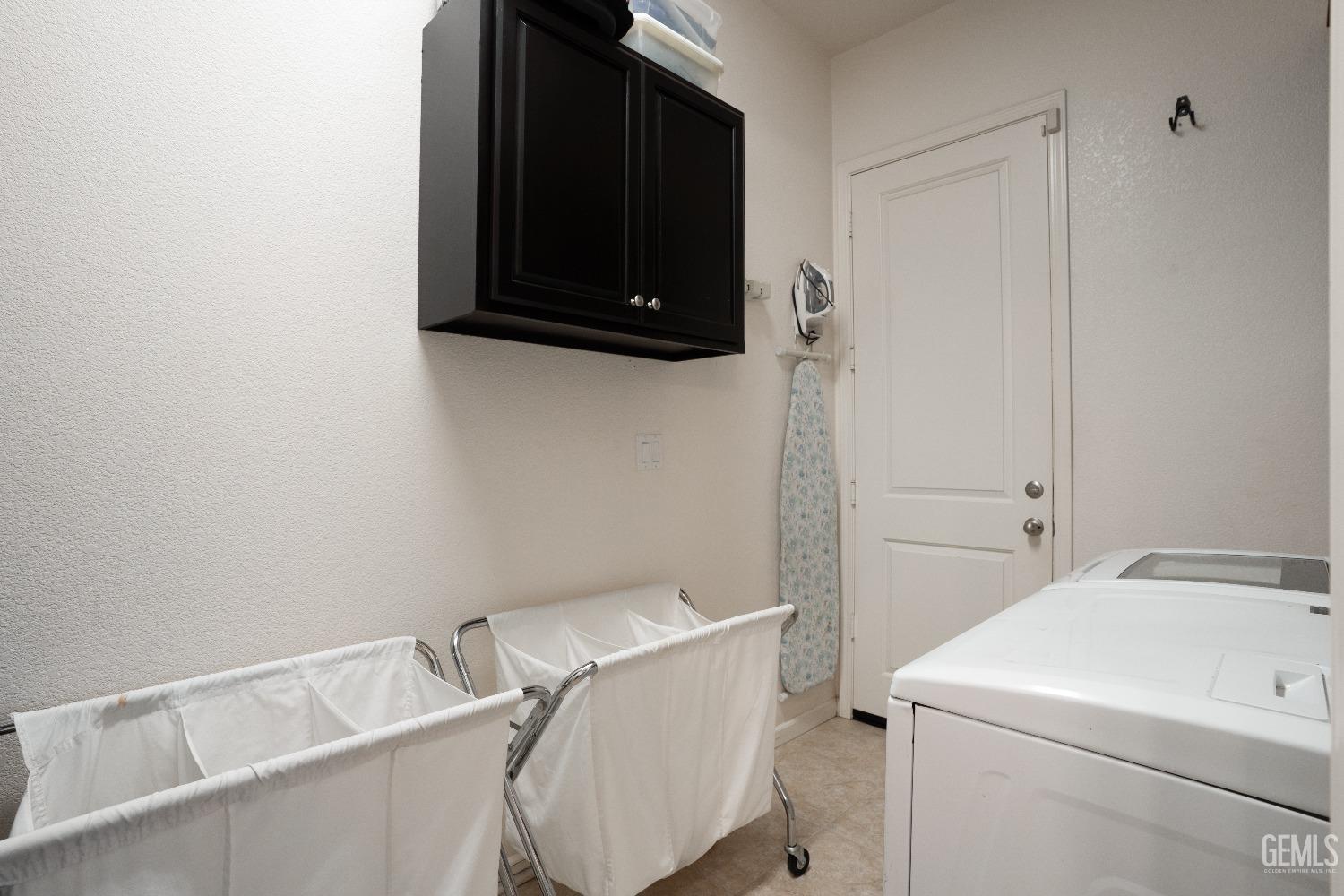 Undisclosed Address Bakersfield, CA 93314 - Photo 28 of 42 a utility room with dryer and washer