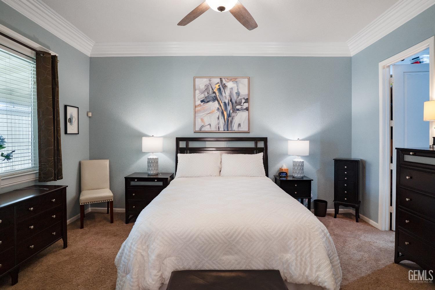 Undisclosed Address Bakersfield, CA 93314 - Photo 32 of 42 a bedroom with a bed and a chandelier