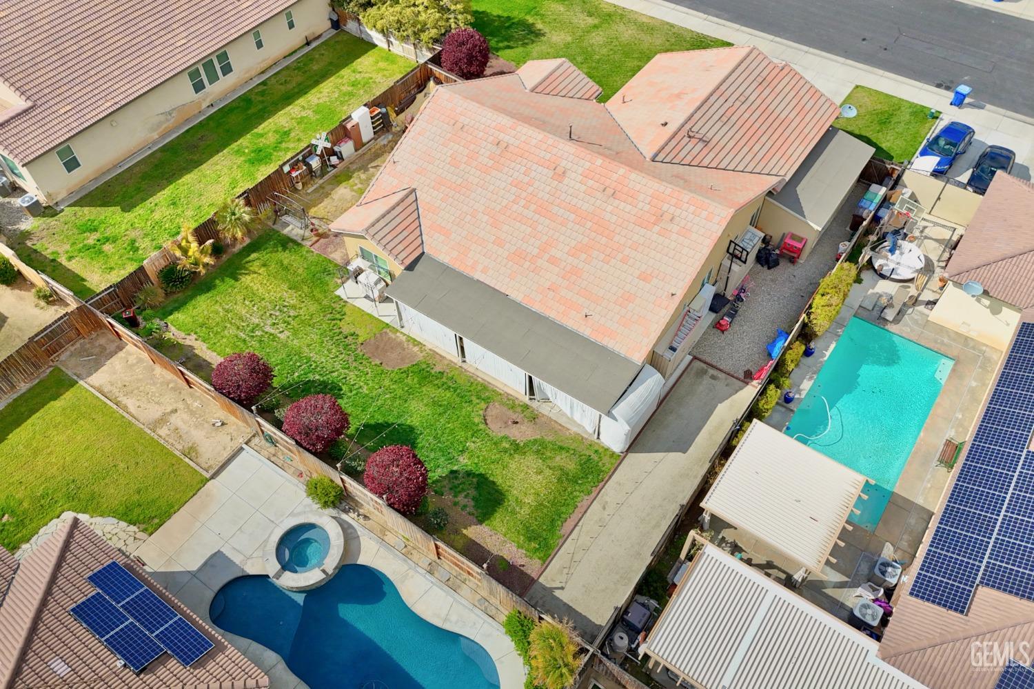 Undisclosed Address Bakersfield, CA 93314 - Photo 4 of 42 an aerial view of a house swimming pool and outdoor space