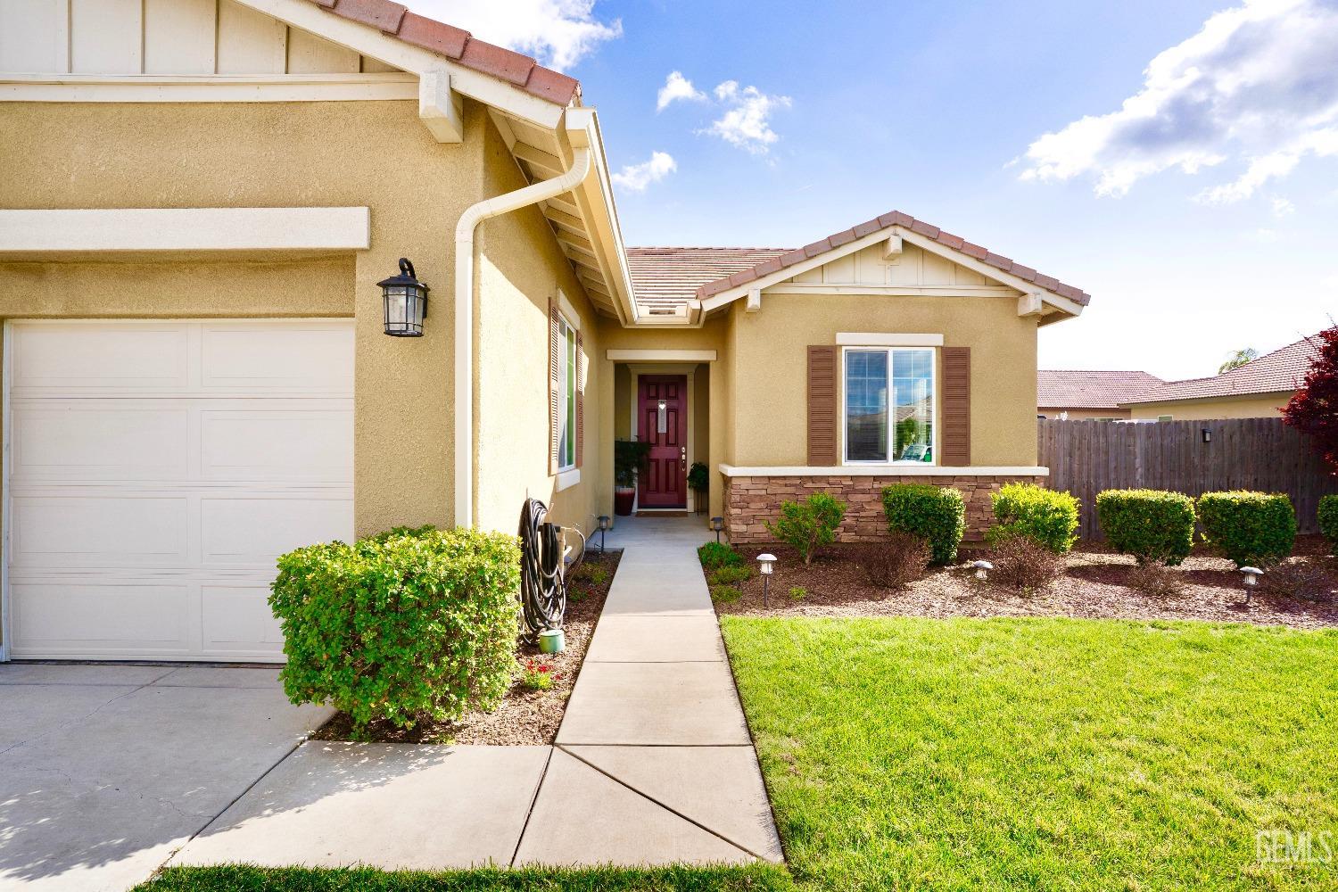 Undisclosed Address Bakersfield, CA 93314 - Photo 5 of 42 a view of a brick house with a yard