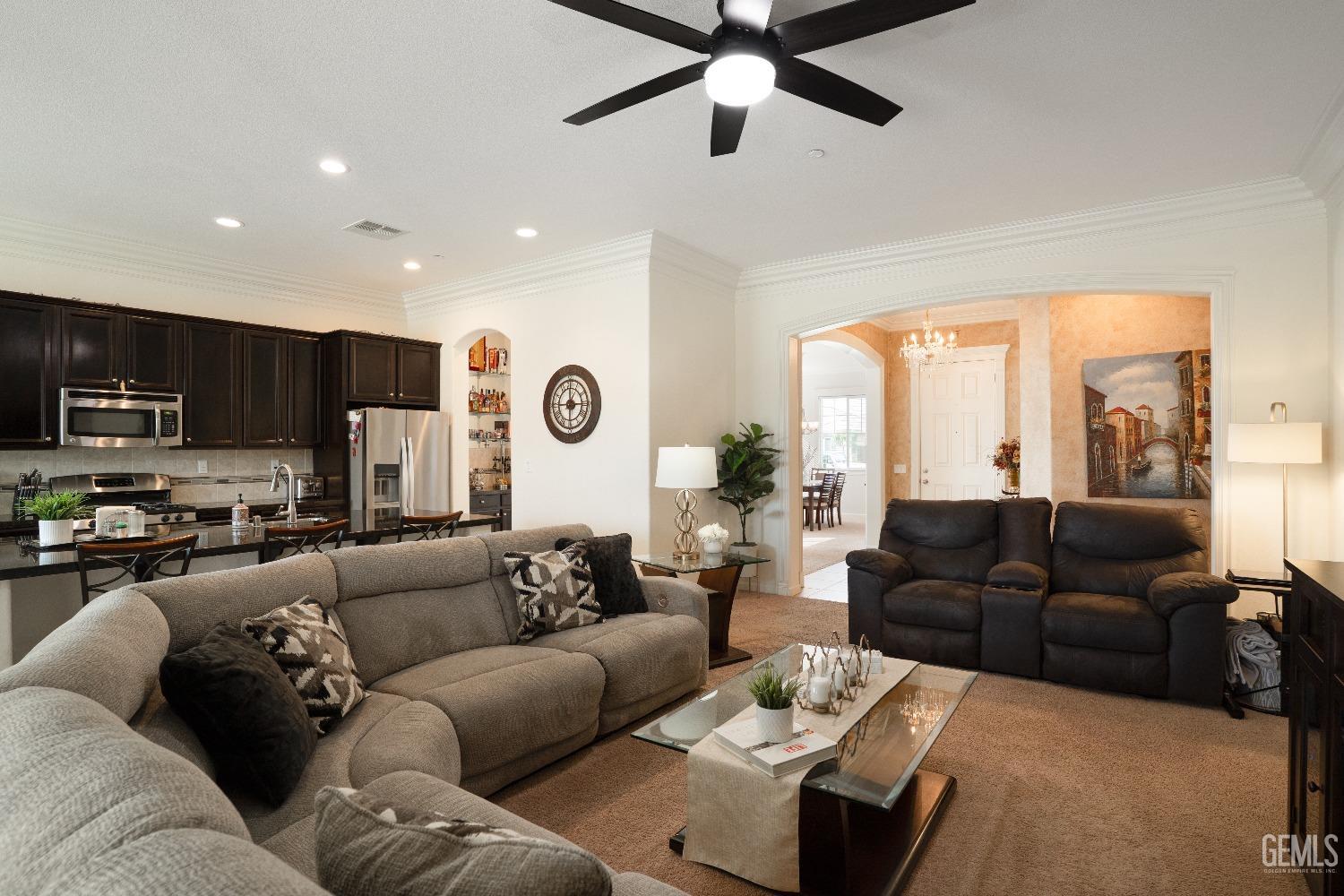 Undisclosed Address Bakersfield, CA 93314 - Photo 7 of 42 a living room with furniture kitchen view and a large window