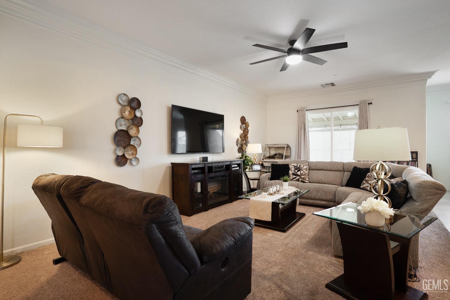 Undisclosed Address Bakersfield, CA 93314 - Photo 8 of 42 a living room with furniture and a flat screen tv