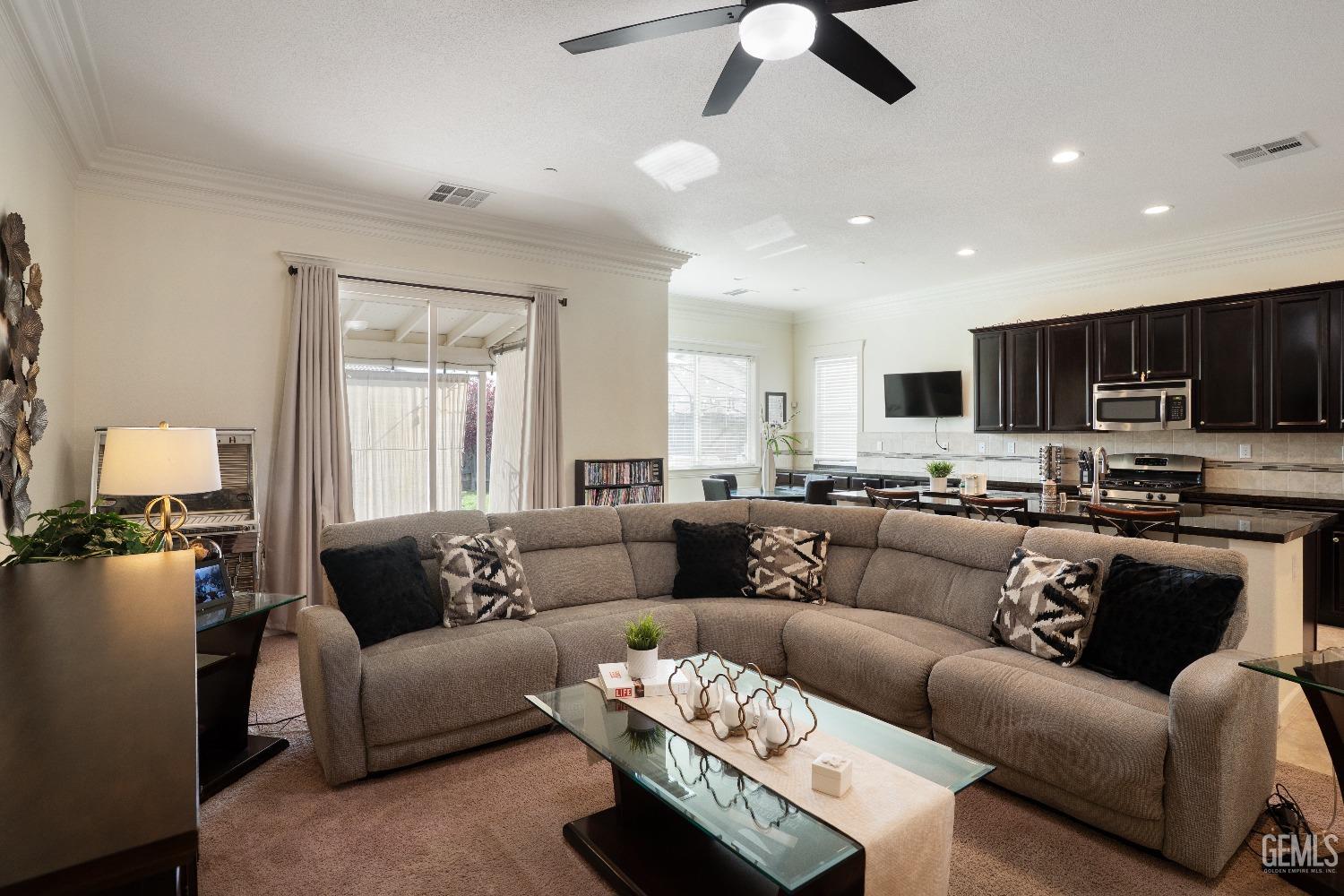 Undisclosed Address Bakersfield, CA 93314 - Photo 9 of 42 a living room with furniture kitchen and a chandelier