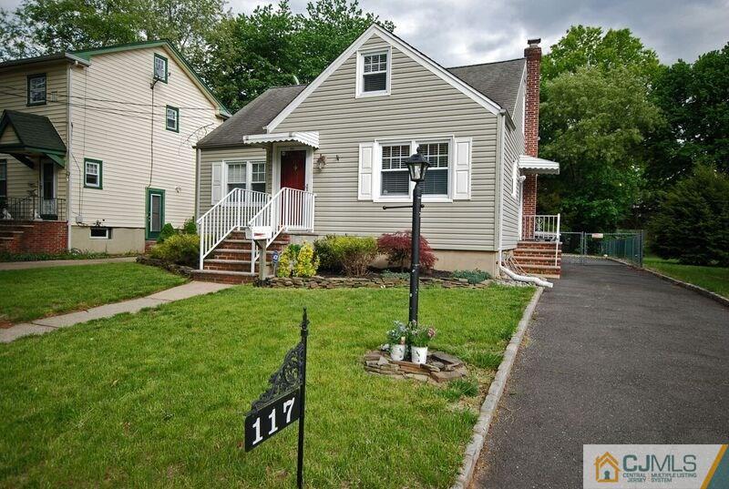 117 2nd Street Dunellen, NJ 08812 - Photo 1 of 25 a front view of a house with garden
