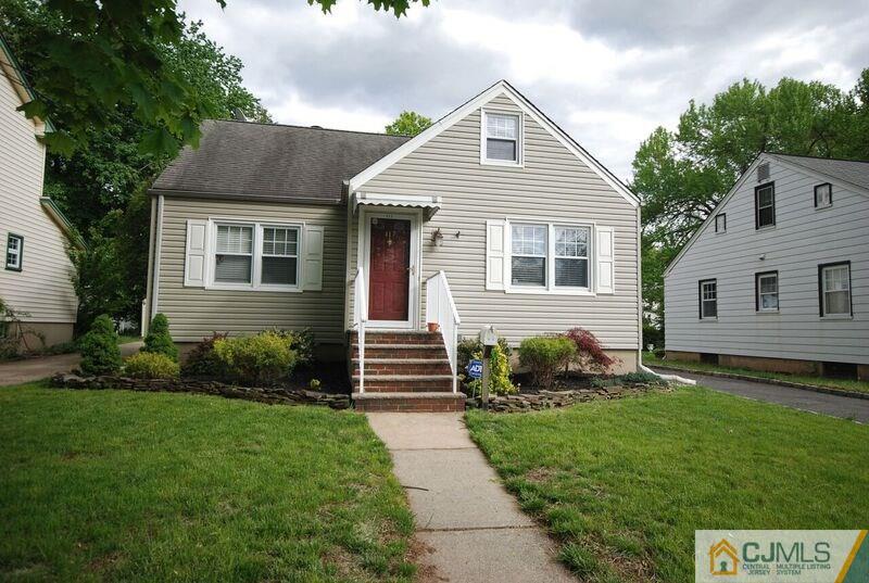 117 2nd Street Dunellen, NJ 08812 - Photo 2 of 25 a front view of a house with a yard