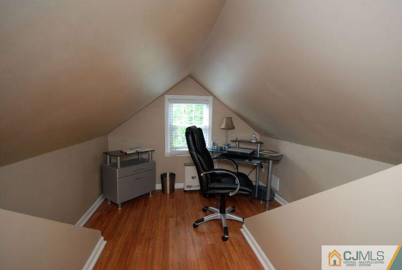 117 2nd Street Dunellen, NJ 08812 - Photo 17 of 25 a view of a workspace with furniture and a window