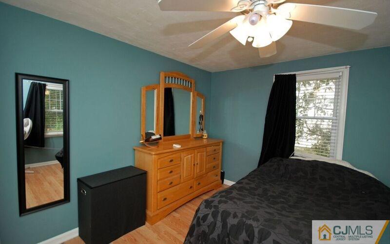 117 2nd Street Dunellen, NJ 08812 - Photo 20 of 25 a bedroom with a bed and a mirror