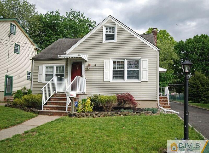 117 2nd Street Dunellen, NJ 08812 - Photo 3 of 25 a front view of a house with garden