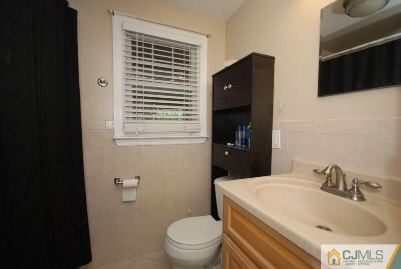 117 2nd Street Dunellen, NJ 08812 - Photo 24 of 25 a bathroom with a sink toilet and shower
