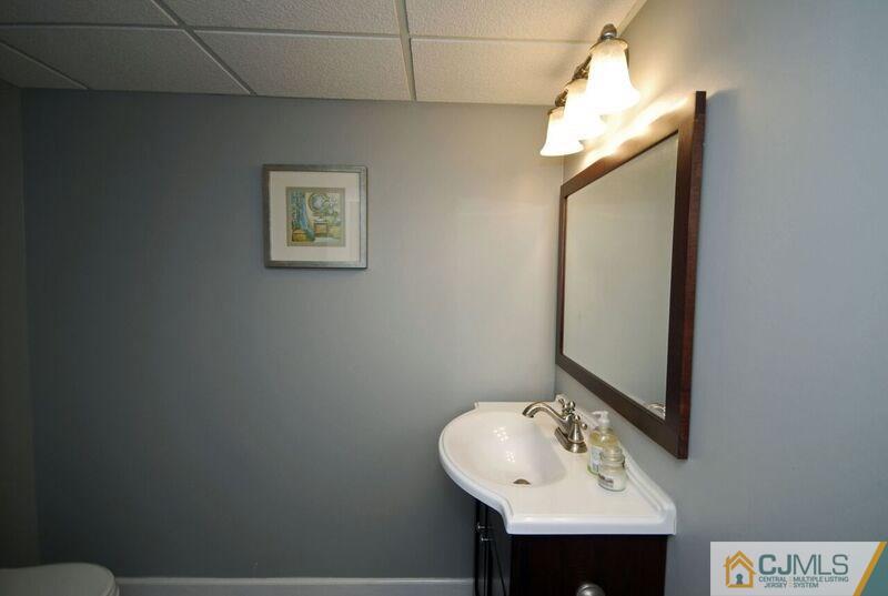 117 2nd Street Dunellen, NJ 08812 - Photo 25 of 25 a bathroom with a sink and a mirror