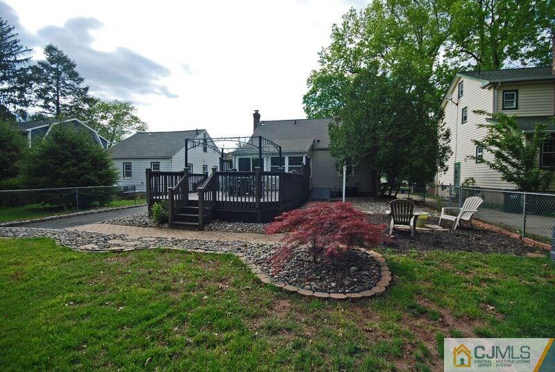117 2nd Street Dunellen, NJ 08812 - Photo 4 of 25 a view of a backyard with plants and a patio