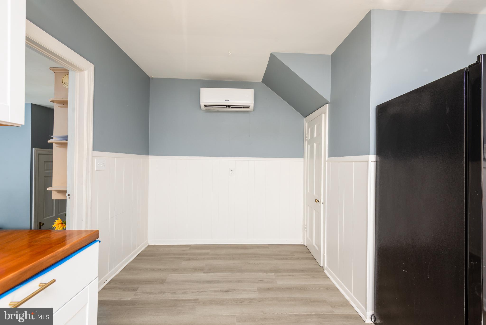 107 Rambler Road Cambridge, MD 21613 - Photo 14 of 28 a view of a hallway with wooden floor and staircase